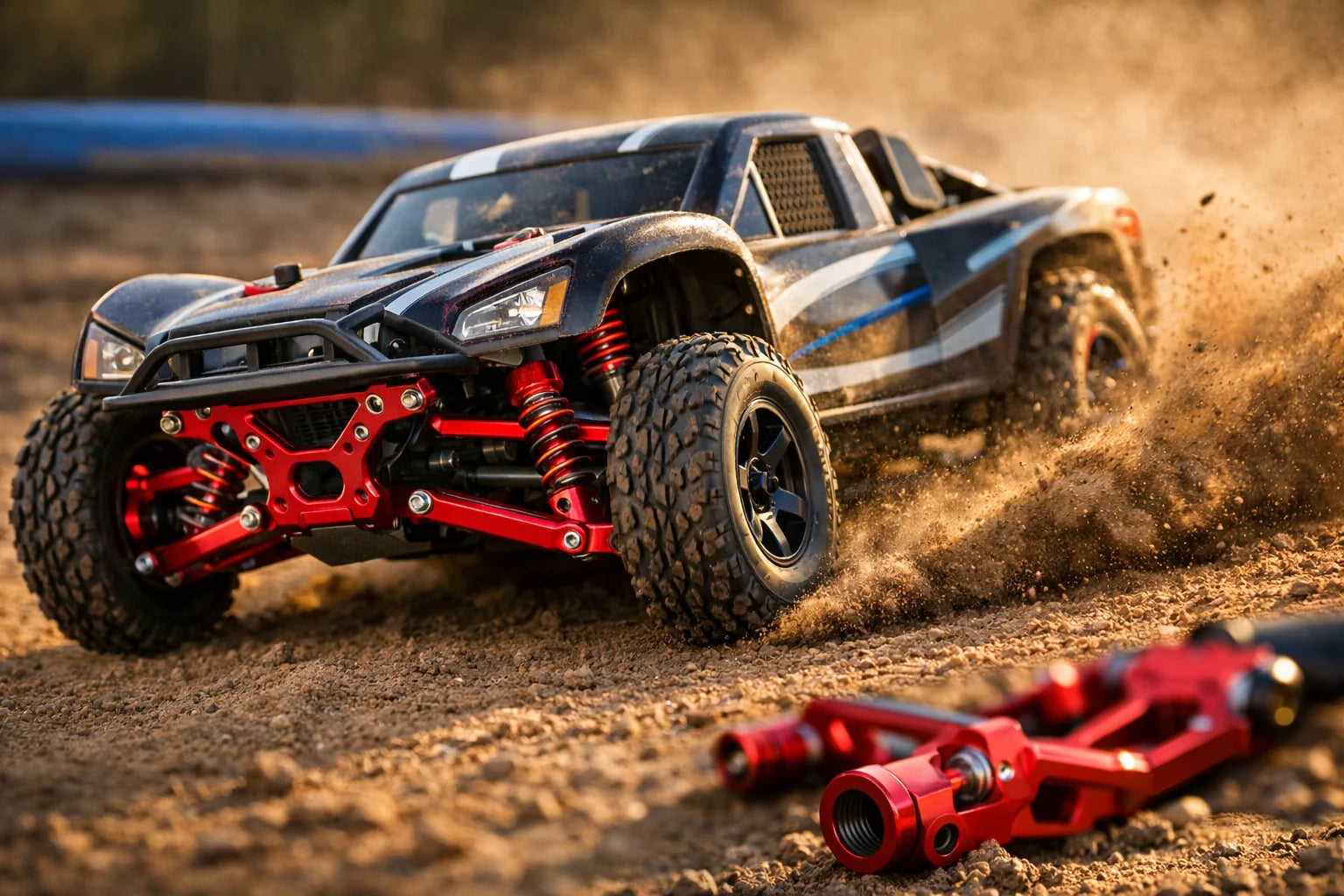 Traxxas Slash with red aluminium hop-up parts ripping through dirt